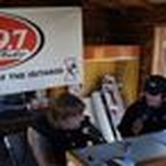 Q/99.7 / KMBQ/FM logo